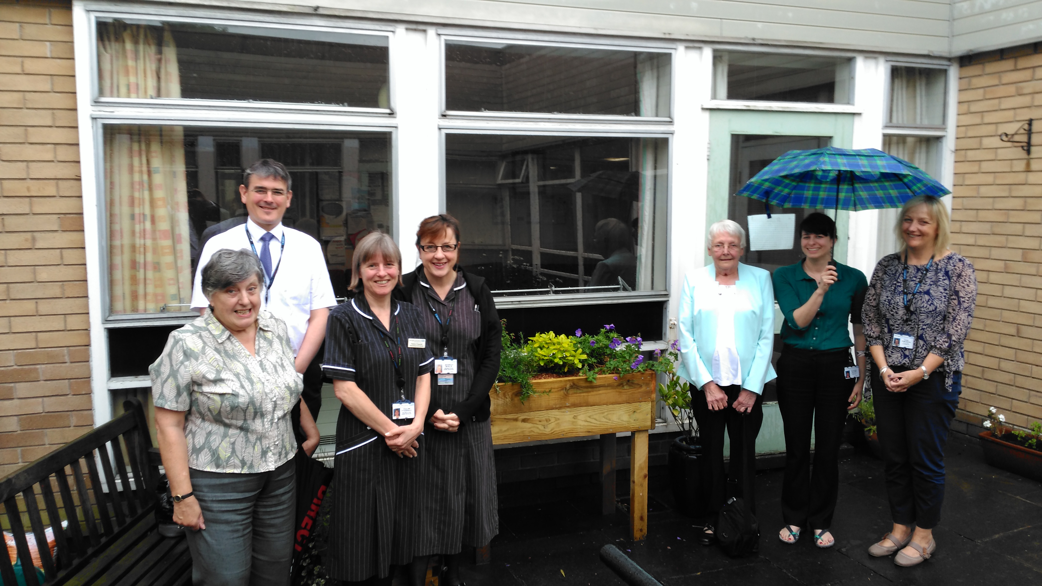 Braving the rain in the Therapy Garden.