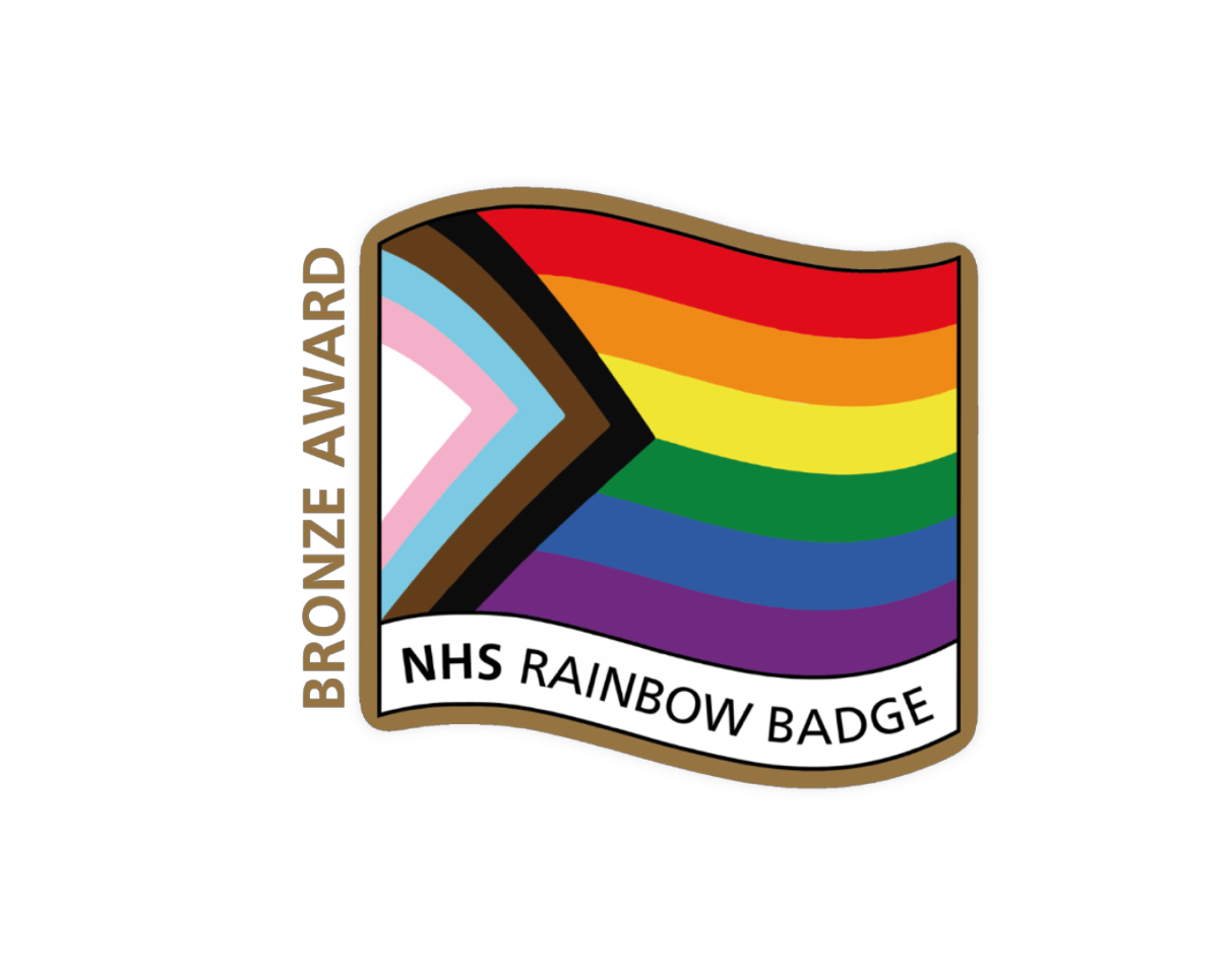 Image of NHS Rainbow badge highlighted in a bronze shadow